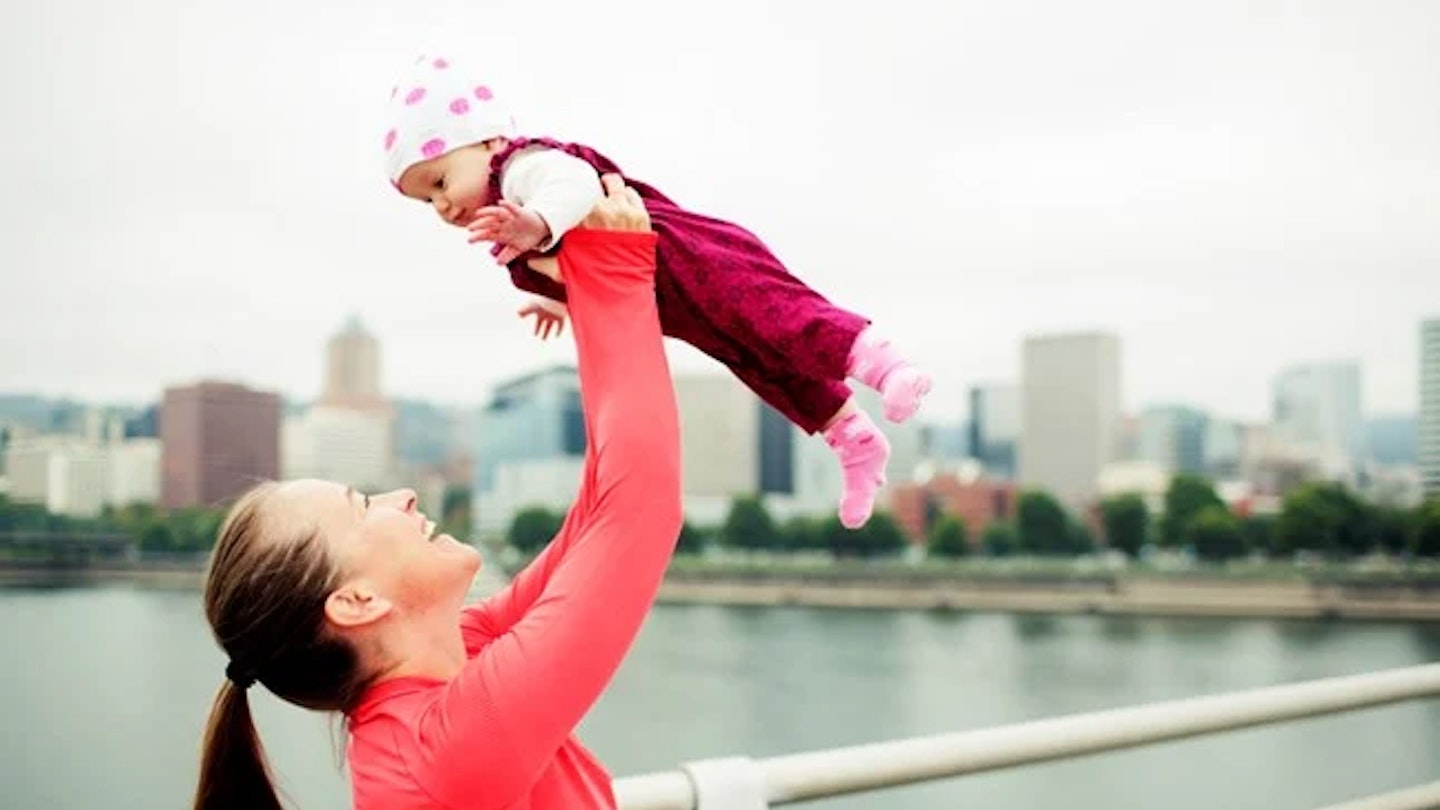 mum holding baby in the air
