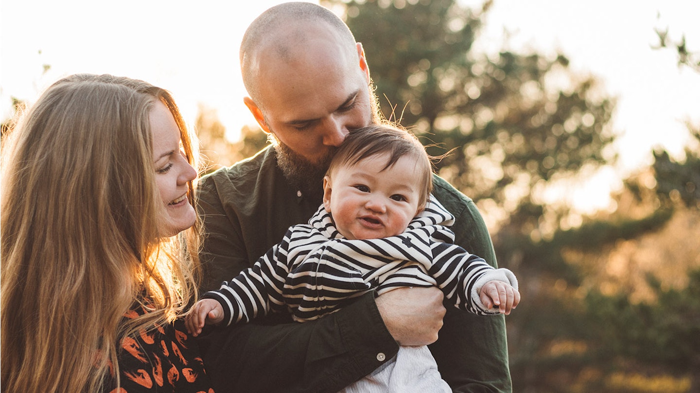 parents with adopted baby