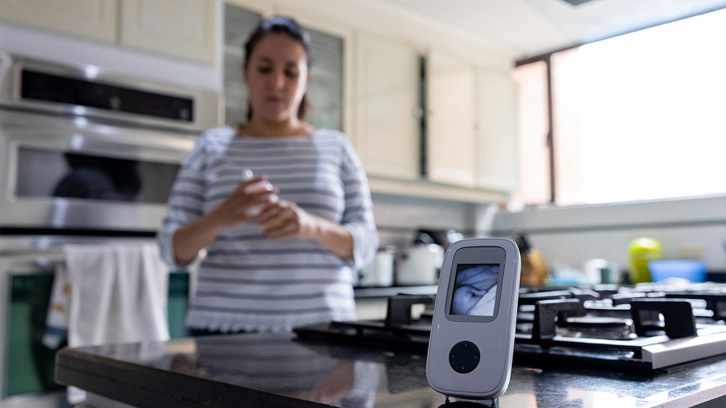 mother using baby monitor