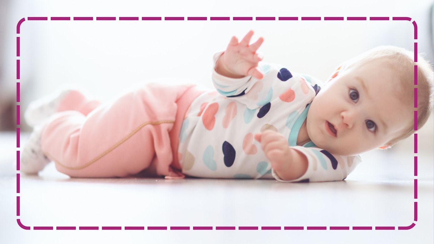 Baby girl rolling over