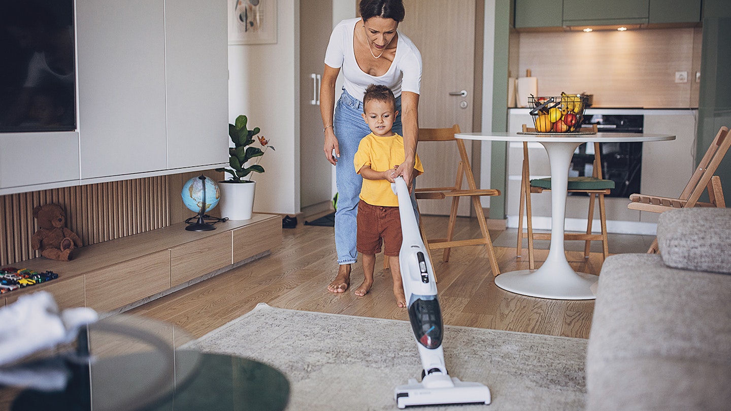 Child and parent vaccuming