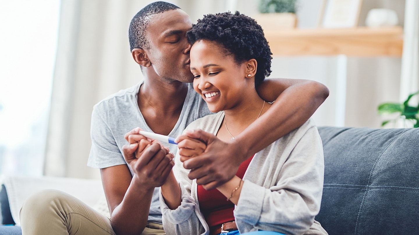 couple with pregnancy test