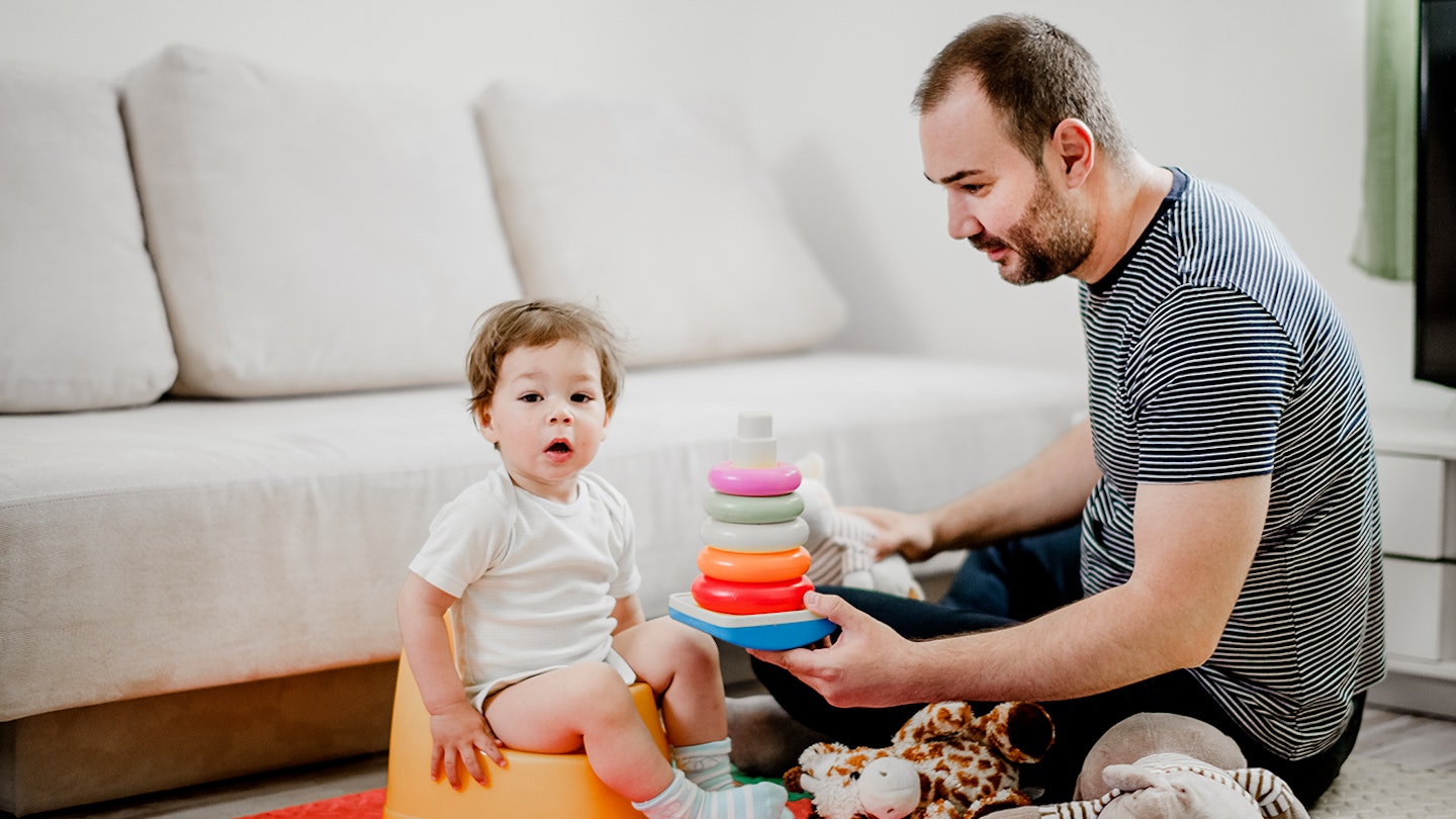 Dad potty training his son