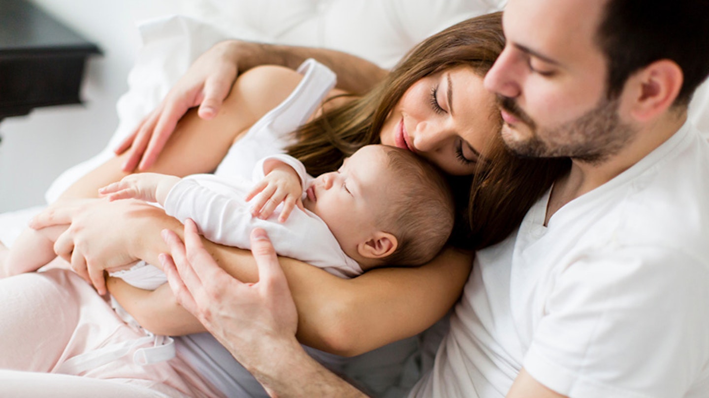 Couple holding a young baby