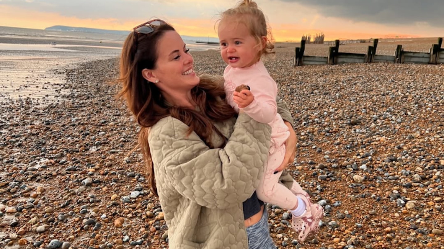 Holly Connolly on beach with daughter