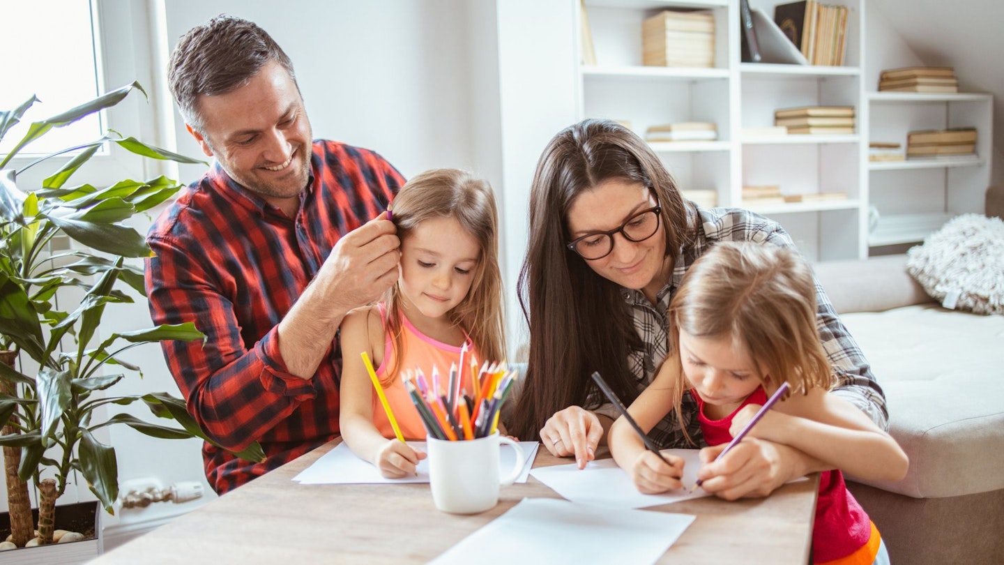 Family writing lists of Family New Year resolutions