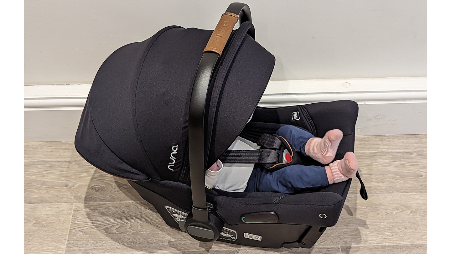 Baby strapped into the Nuna PIPA urbn