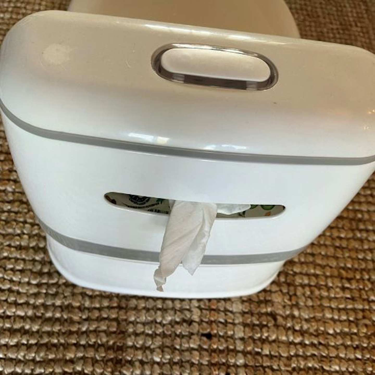 The back of the Pote Plus My First WC showing the storage for wipes