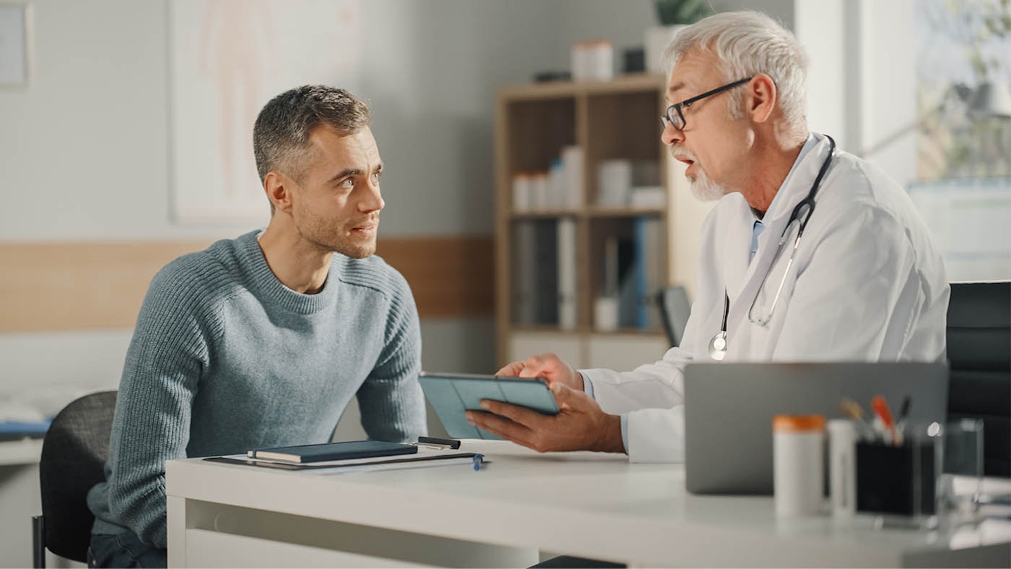 man talking to doctor